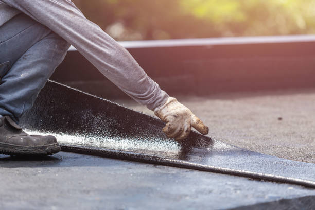 Professional Waterproofing technician working in Walhalla, MI